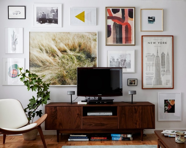 large-art-gallery-wall-to-hide-a-TV-Cup-of-Jo