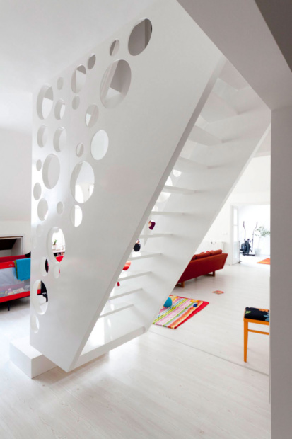 white-stairs-design-for-small-spaces-laminated-wooden-floor-staircase-in-living-room-design-red-sofa